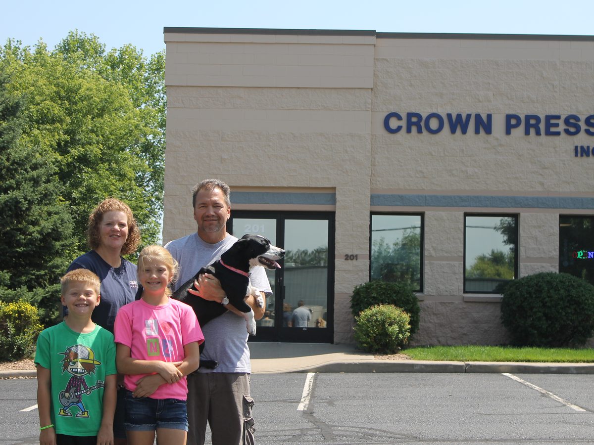 The Crown Press Inc family outside their printing shop in Sauk Rapids, MN